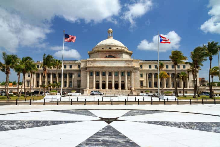 Capital of Puerto Rico building with two flags in San Juan, PR.